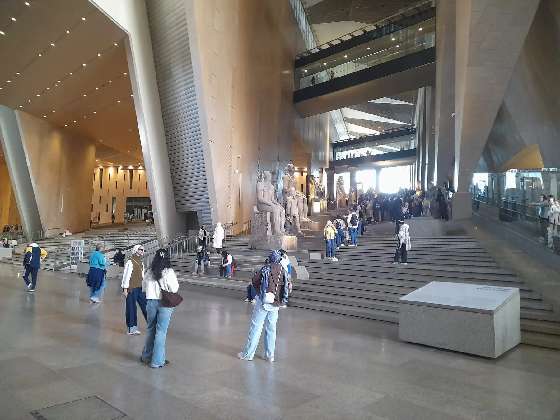 Visitors at the Grand Staircase inside the Grand Egyptian Museum during opening hours